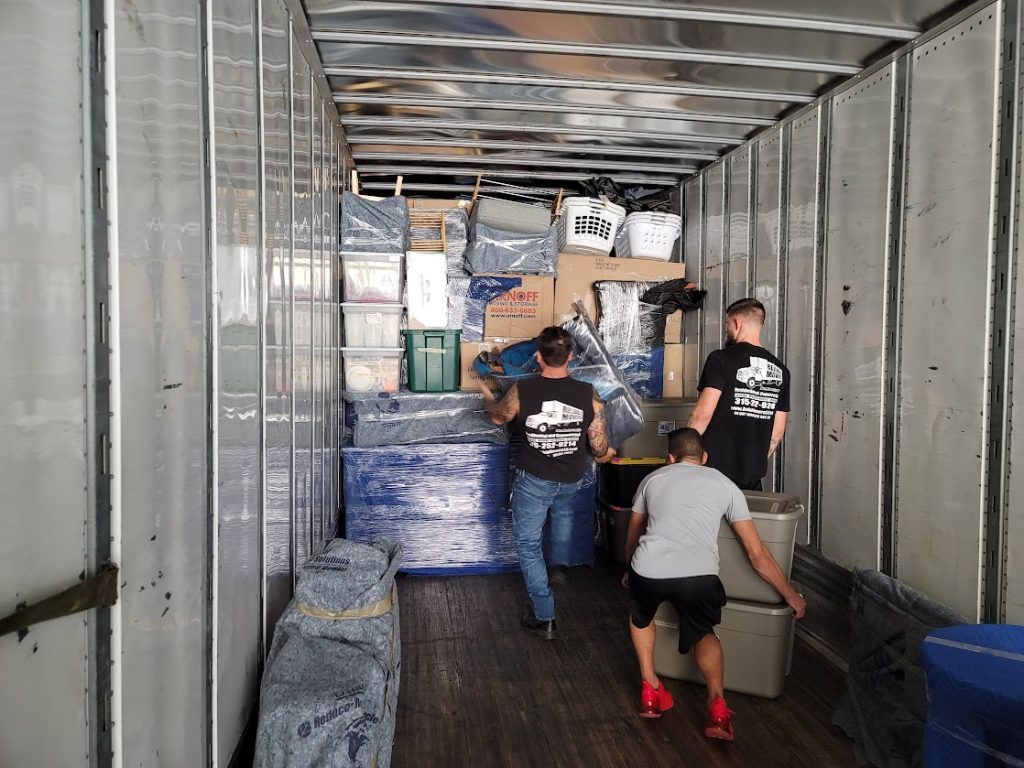 It takes a team—our crew loading with precision and coordination for long-distance moves to North Carolina and Florida.