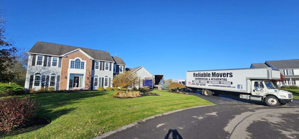 Reliable Movers crew performing a two-truck local move from Manlius to storage on October 21, 2025